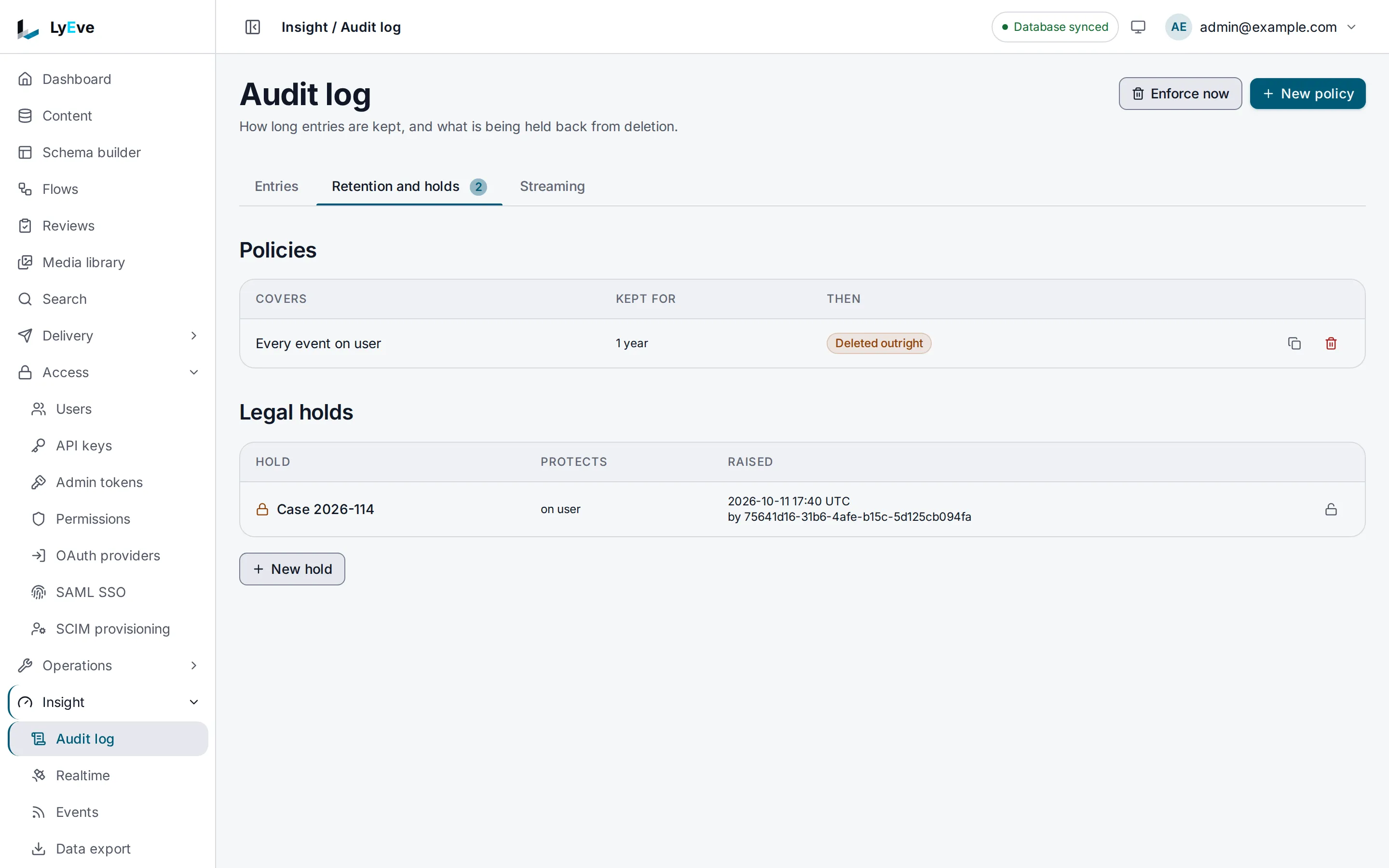 The Retention and holds tab with a policy that keeps every event on user for one year and then deletes it, and a legal hold named Case 2026-114 that protects entries on user.